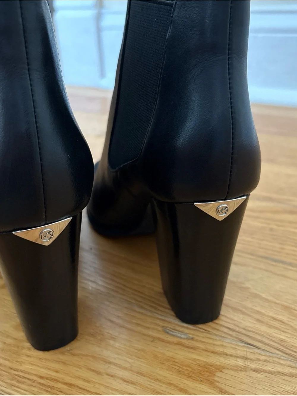 Michael Kors Black Leather Chelsea Block Heel Booties with Metal Accent